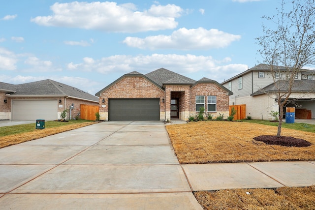 view of front of house with a garage and a front lawn