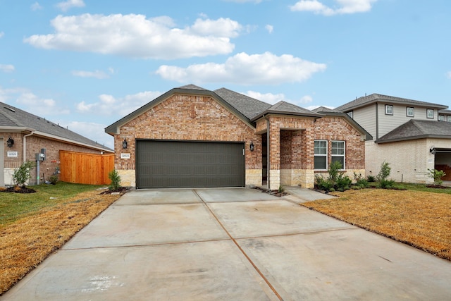 view of front facade featuring a garage and a front yard