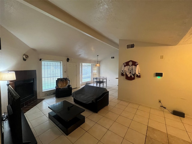 tiled living room with lofted ceiling with beams