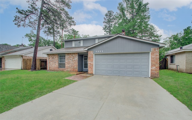 view of front facade with a front yard and a garage