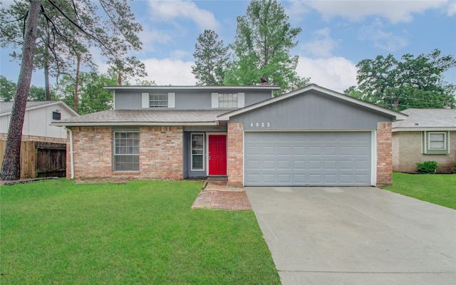 view of front property with a garage and a front lawn