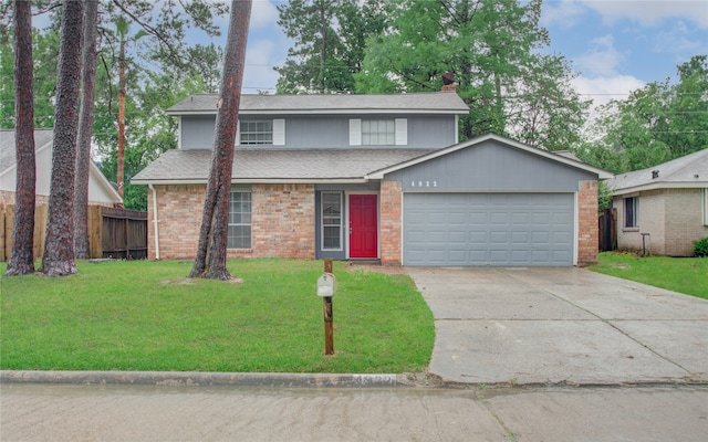 front facade with a front lawn and a garage