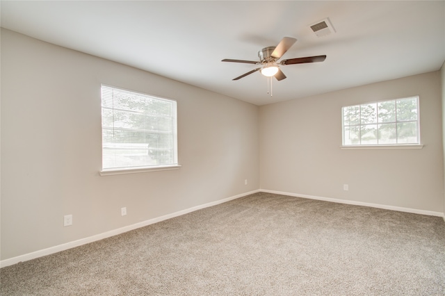 unfurnished room featuring carpet and ceiling fan