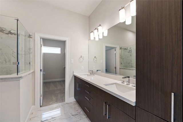 bathroom featuring a tile shower and vanity