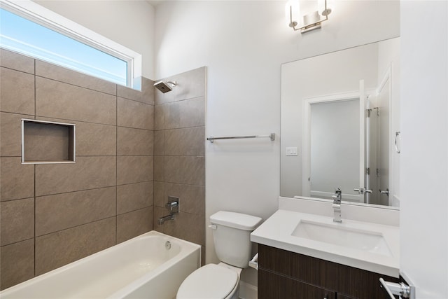 full bathroom with tiled shower / bath combo, toilet, and vanity