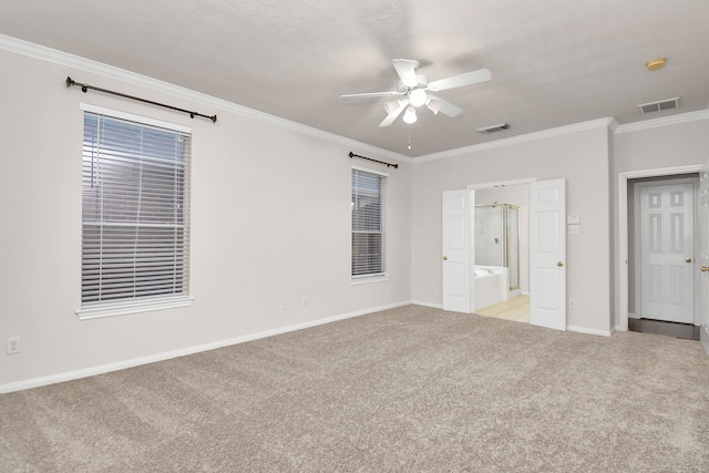 unfurnished bedroom with ceiling fan, crown molding, light carpet, and ensuite bath