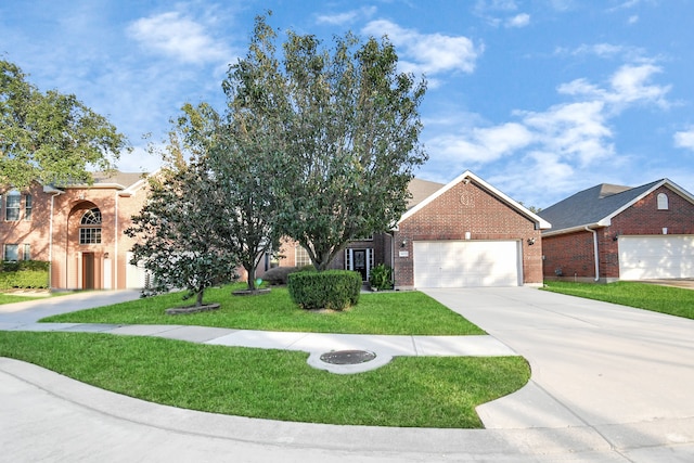 view of front facade featuring a front yard and a garage