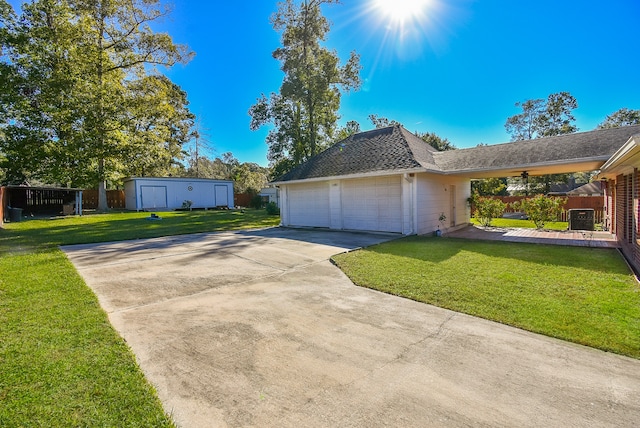 view of side of home featuring an outbuilding, a yard, and a garage