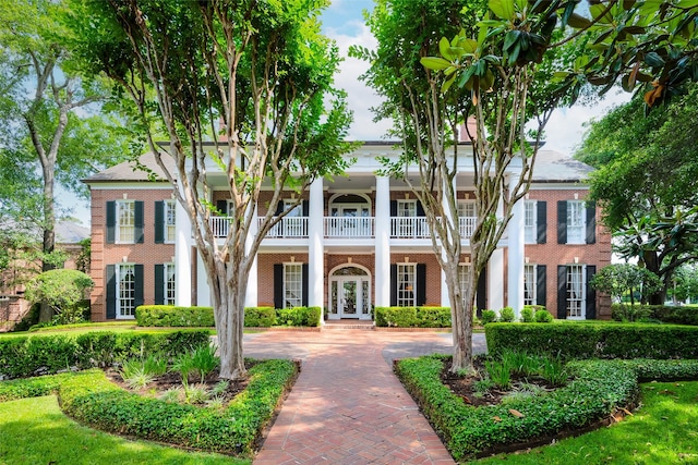 greek revival inspired property featuring french doors