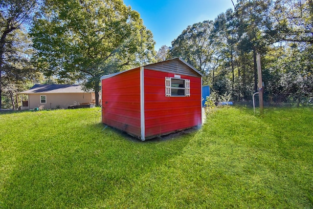 view of outdoor structure with a yard