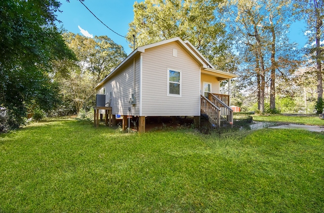 view of home's exterior with a lawn