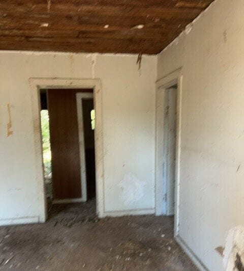 empty room with wooden ceiling