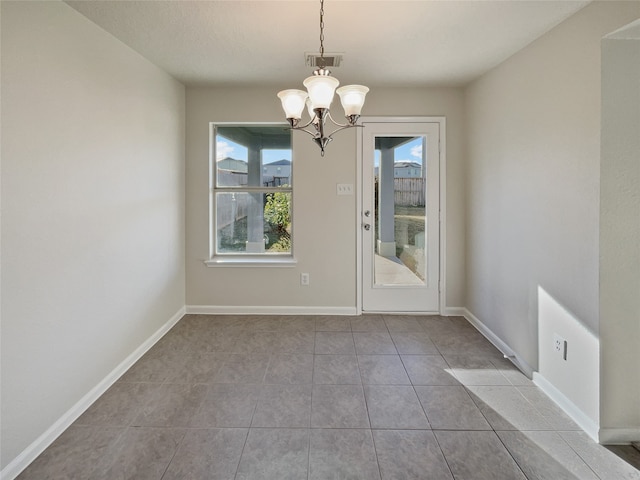 unfurnished dining area featuring a notable chandelier, plenty of natural light, and light tile patterned floors