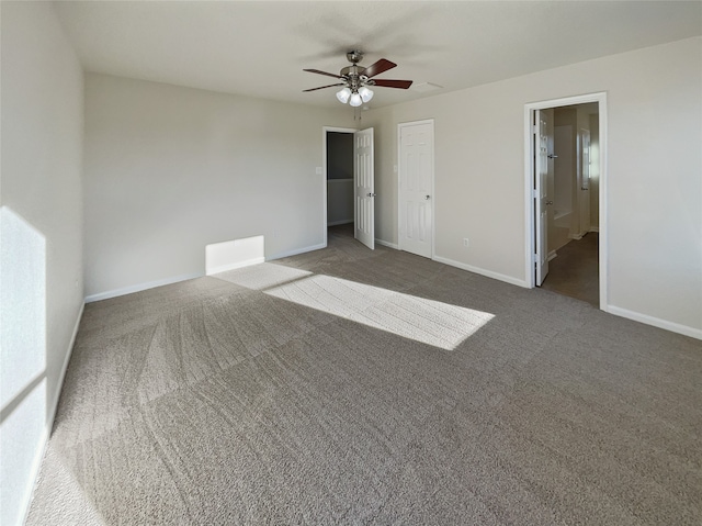 unfurnished bedroom with carpet flooring, connected bathroom, and ceiling fan