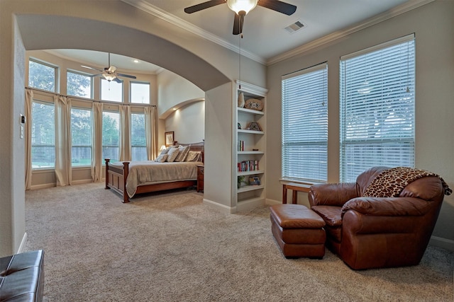 bedroom with ceiling fan, light colored carpet, and ornamental molding