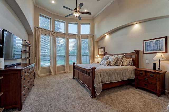 bedroom featuring crown molding, recessed lighting, a high ceiling, light carpet, and ceiling fan