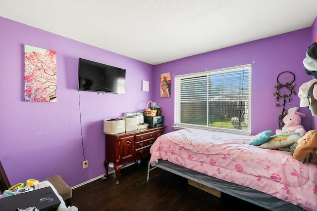 bedroom with hardwood / wood-style floors