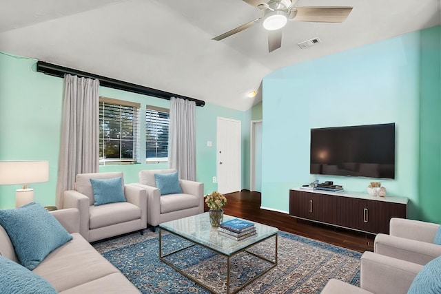 living room featuring ceiling fan, dark hardwood / wood-style flooring, and lofted ceiling