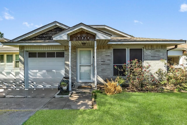 ranch-style home with a garage and a front yard