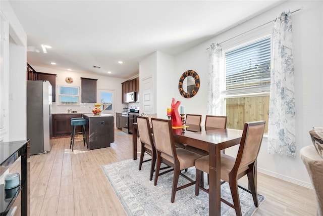 dining space featuring light hardwood / wood-style flooring