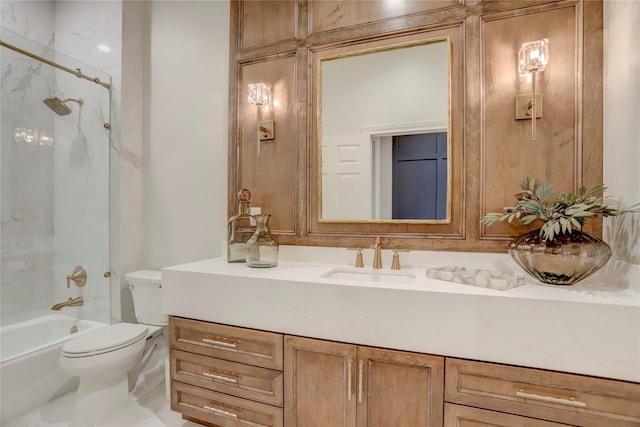 full bathroom with vanity, toilet, and tiled shower / bath