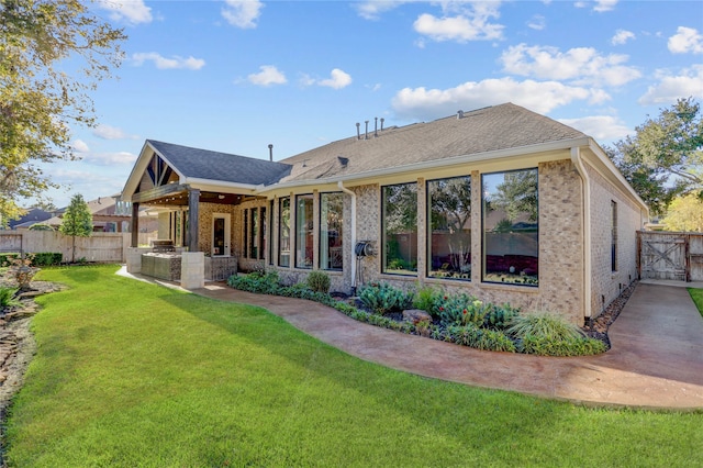 back of property featuring a lawn