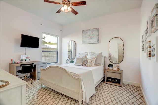 bedroom with ceiling fan and light colored carpet