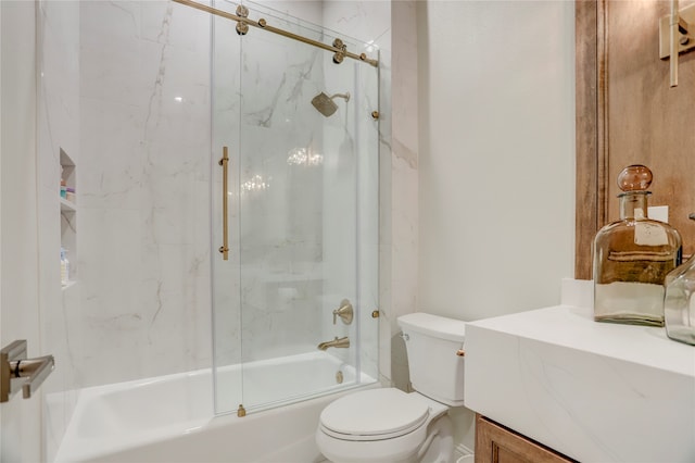 full bathroom with vanity, toilet, and enclosed tub / shower combo