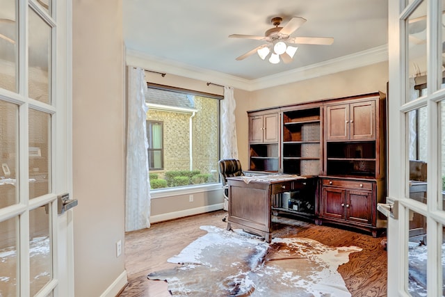 office space featuring french doors, dark hardwood / wood-style floors, ceiling fan, and ornamental molding