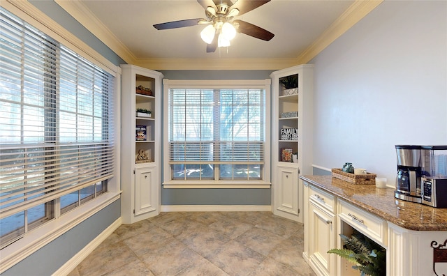 interior space with crown molding and ceiling fan