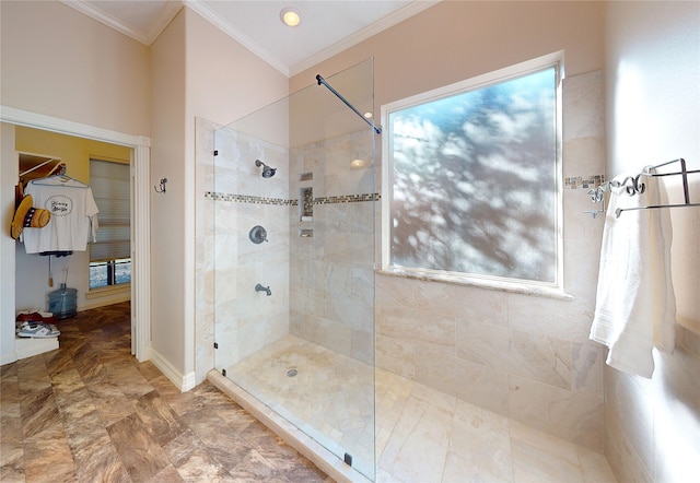 bathroom featuring tiled shower and ornamental molding