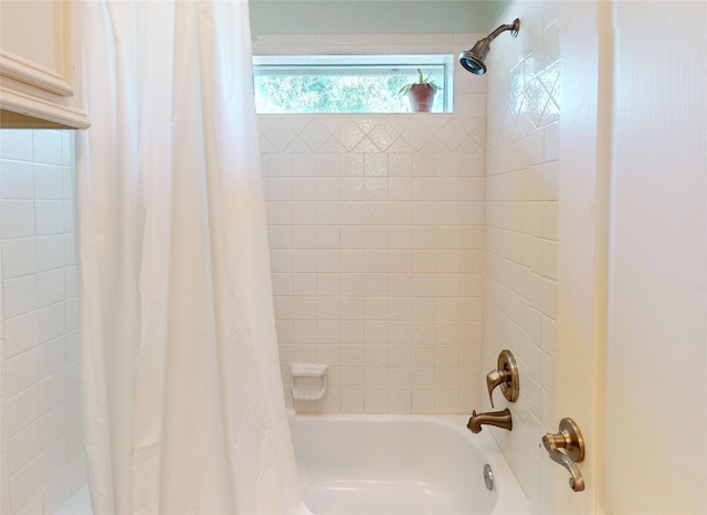 bathroom featuring shower / tub combo with curtain