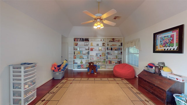 rec room with hardwood / wood-style floors, ceiling fan, and lofted ceiling