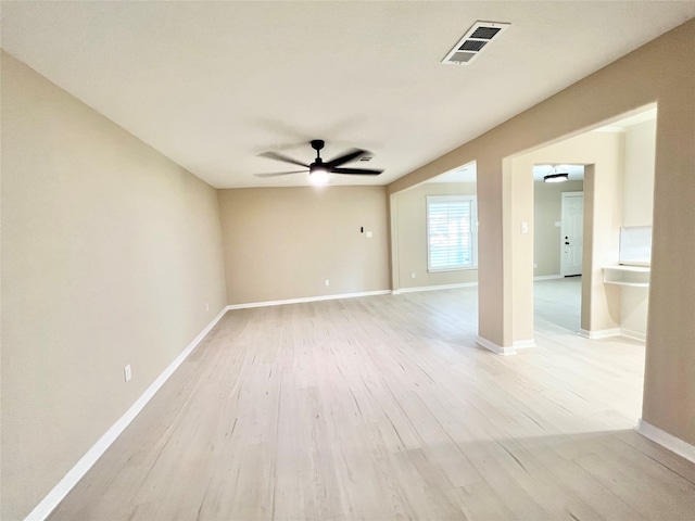 empty room featuring ceiling fan and light hardwood / wood-style floors