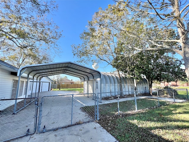 exterior space with a carport, a garage, and a lawn