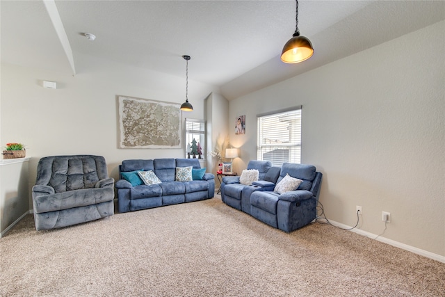 living room with carpet floors and vaulted ceiling