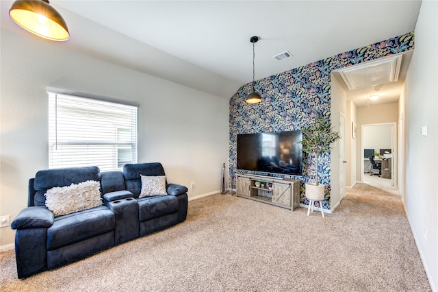 carpeted living room with lofted ceiling