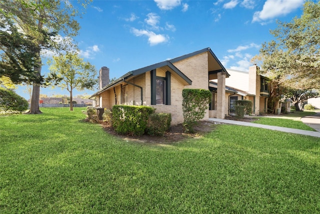 view of home's exterior featuring a lawn