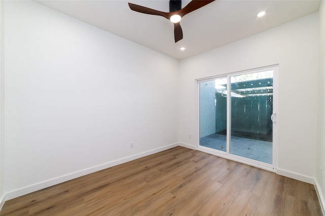 empty room featuring ceiling fan and light wood-type flooring