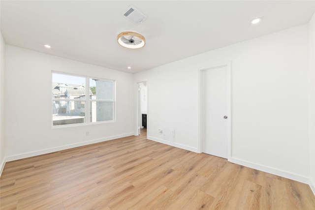 unfurnished room with light hardwood / wood-style flooring