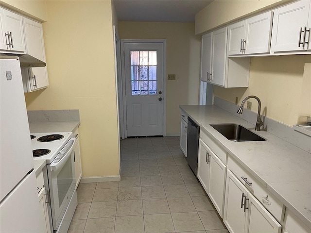 kitchen featuring light stone countertops, white appliances, sink, light tile patterned floors, and white cabinetry