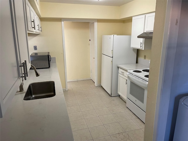 kitchen with white cabinets, light tile patterned floors, white appliances, and sink