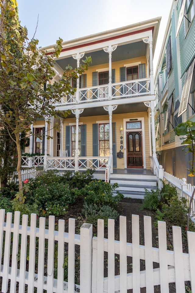 view of front of house featuring a balcony