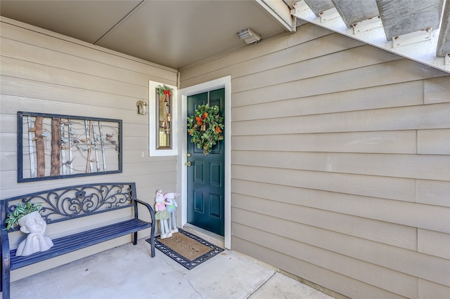 view of exterior entry featuring a porch