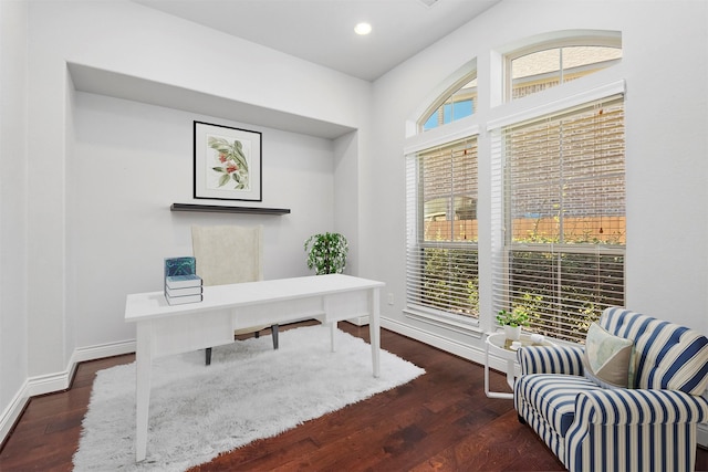 home office with dark hardwood / wood-style floors