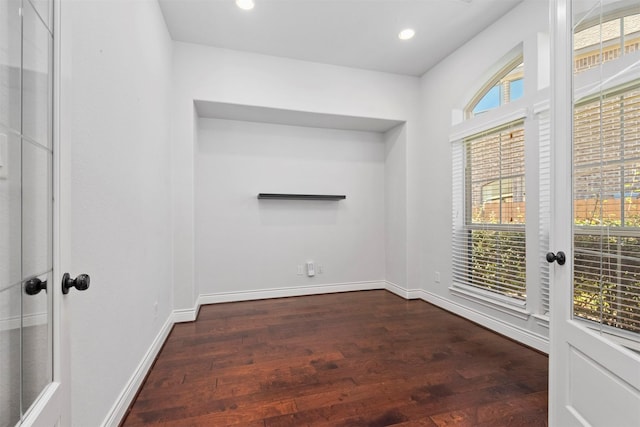 spare room featuring dark hardwood / wood-style floors