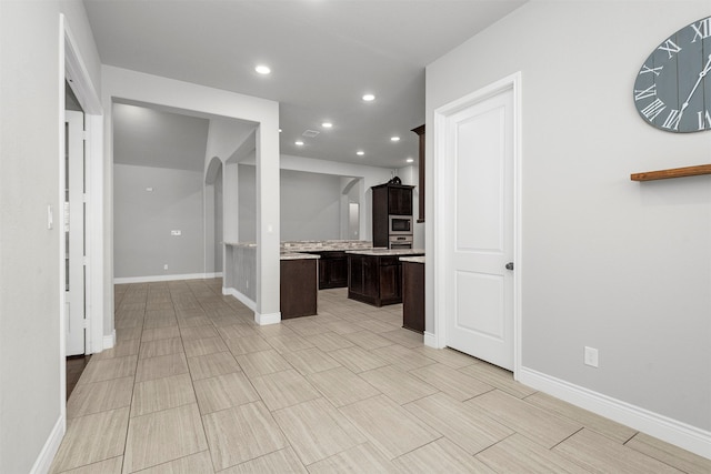 kitchen featuring dark brown cabinets