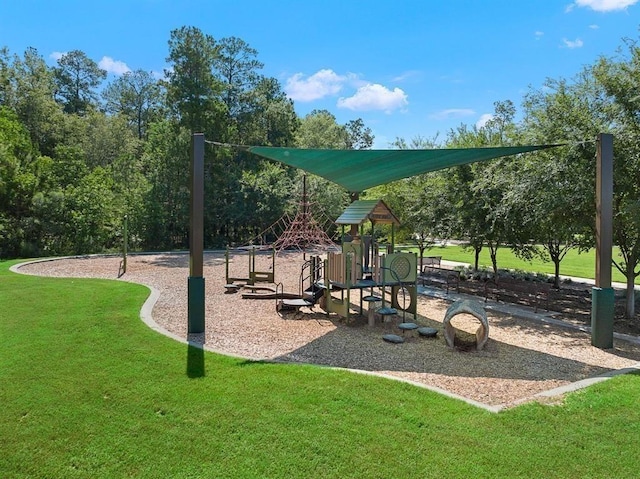 view of jungle gym featuring a lawn