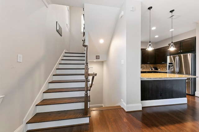 stairs with hardwood / wood-style flooring