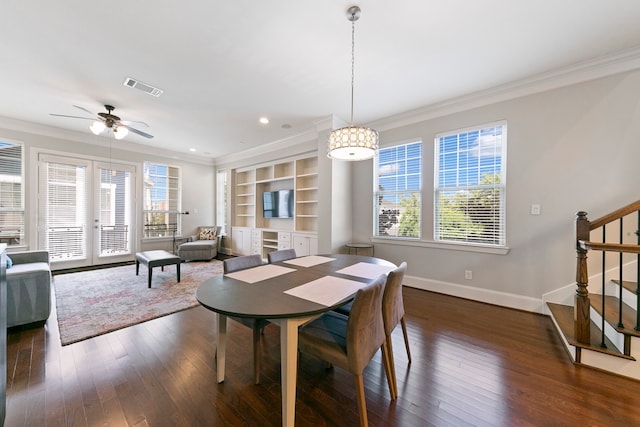 dining room featuring ceiling fan, dark hardwood / wood-style flooring, and crown molding